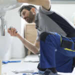 Plumber,Repairing,A,Bathroom,Sink,,Professional,Service,Concept